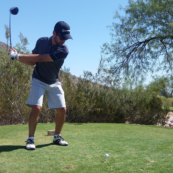 Aaron playing golf.